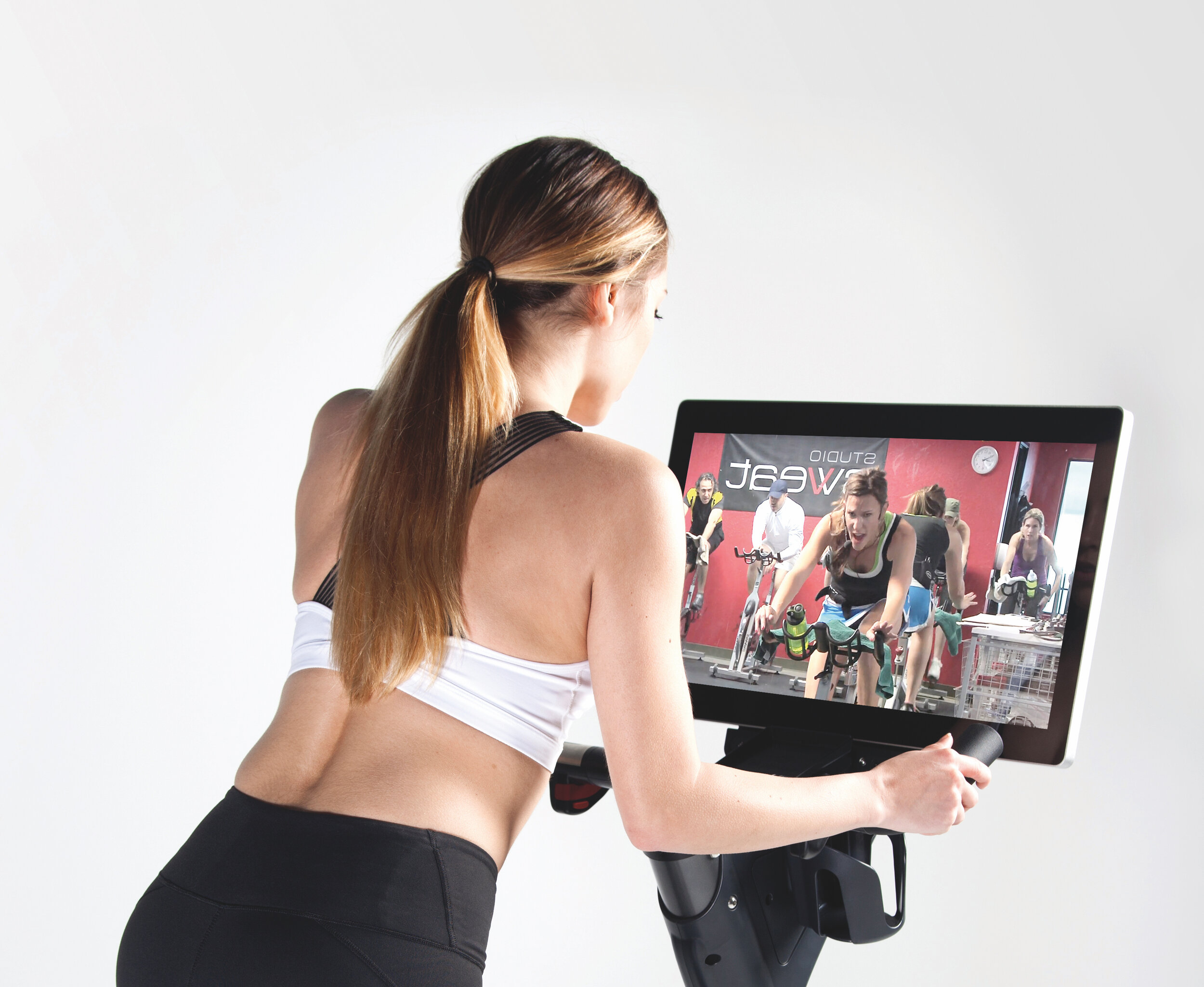 TAKE ON A SPIN CLASS WITH CAT KOM AND HER TEAM